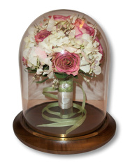 bouquet preserved in glass table dome
